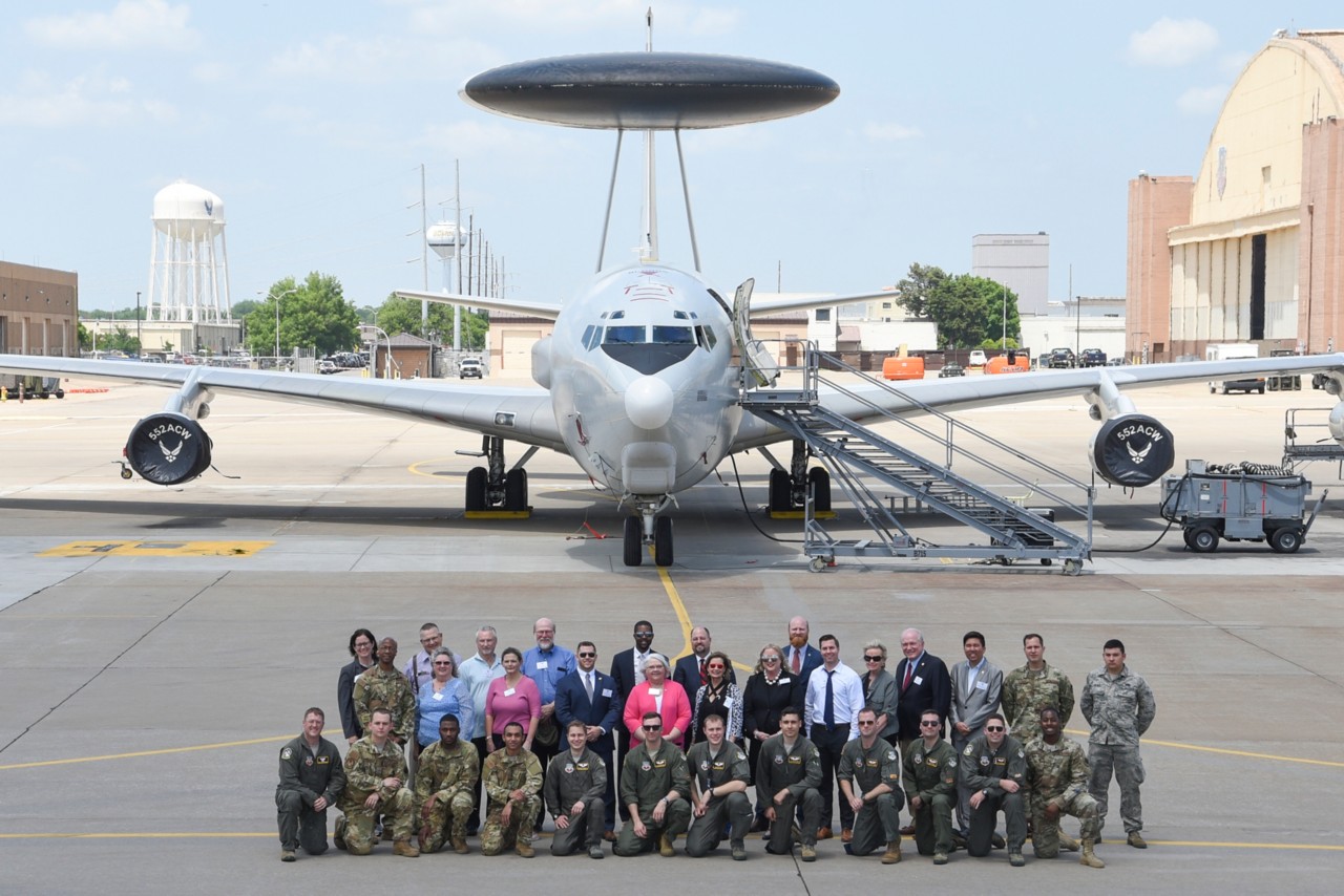 Group photo showing members of the 552nd Air Control Wing with House and Senate members of the State of Oklahoma following a tour of an E-3G Sentry Airborne Warning and Control System aircraft May 16, 2019, Tinker Air Force Base, Oklahoma. The Oklahoma legislatures learned about the E-3s systems and capabilities as the largest single unit at Tinker AFB. (U.S. Air Force photo/Greg L. Davis)
