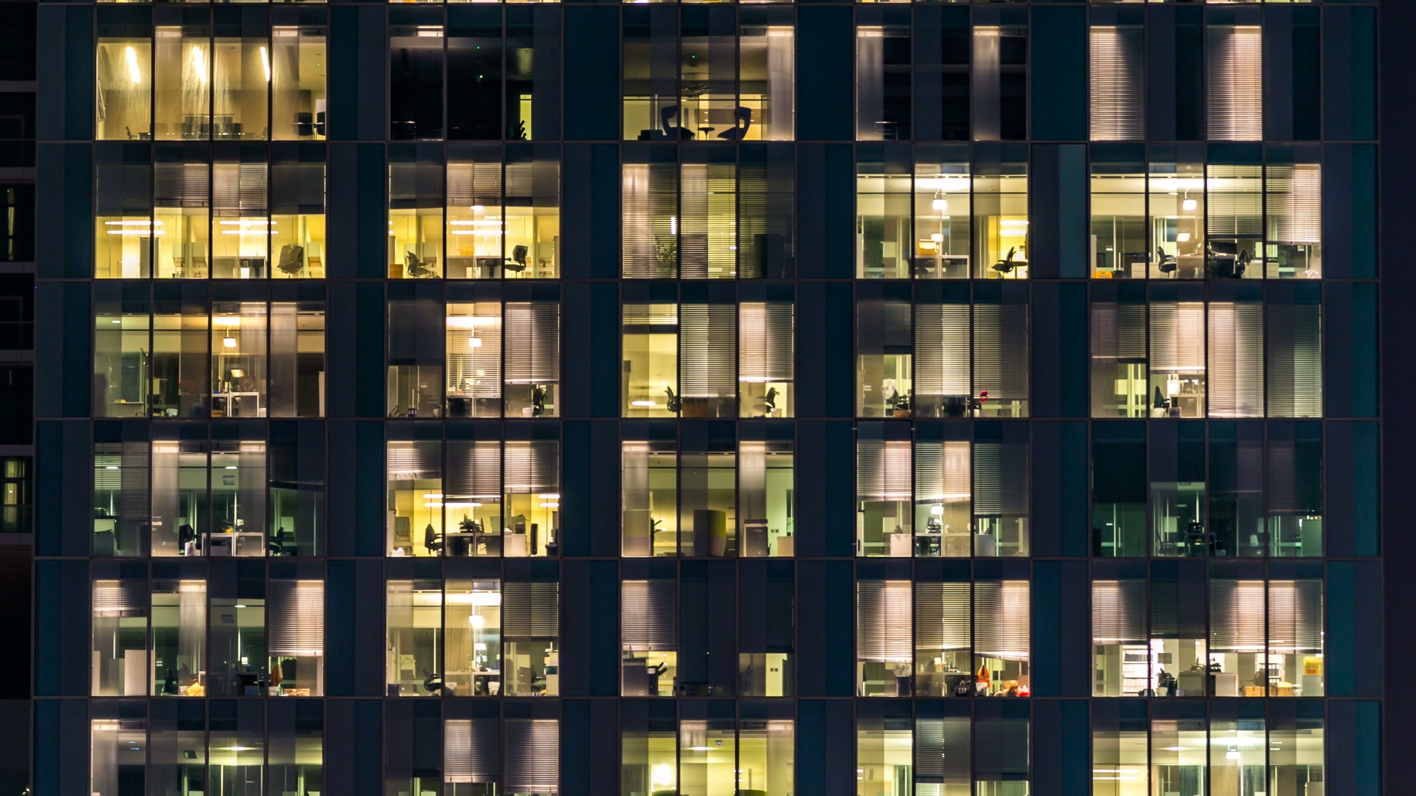 Architecture of a window of the multi-storey building of glass and steel lighting and people within timelapse Architecture - Blinking light in window of the multi-storey building of glass and steel lighting and people within timelapse close up view. Dubai, UAE