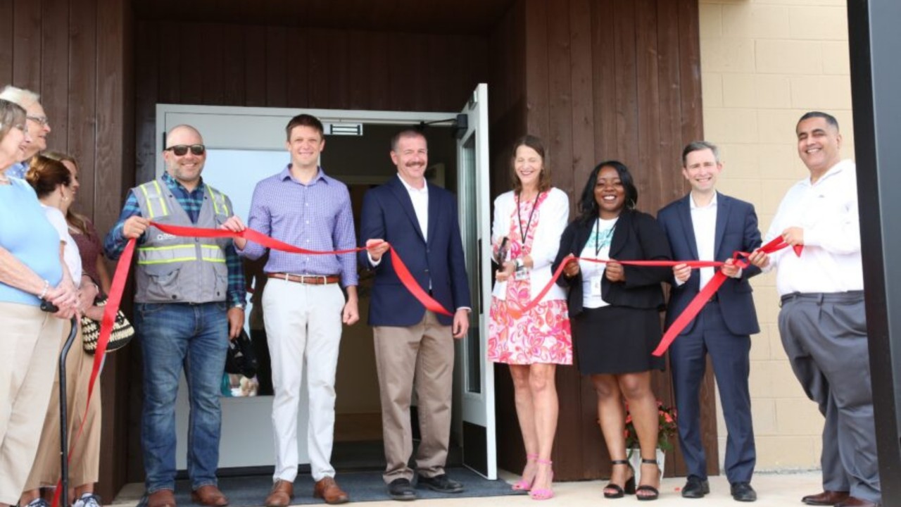 Project leaders perfoming a ribbon-cutting at the newly renovated Goodrich Counseling Center.