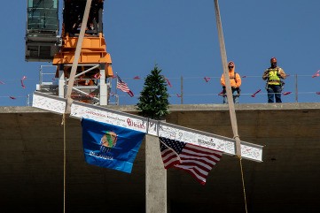 Workers hoist the final beam into place for the OU Children's Hospital mental health facility.