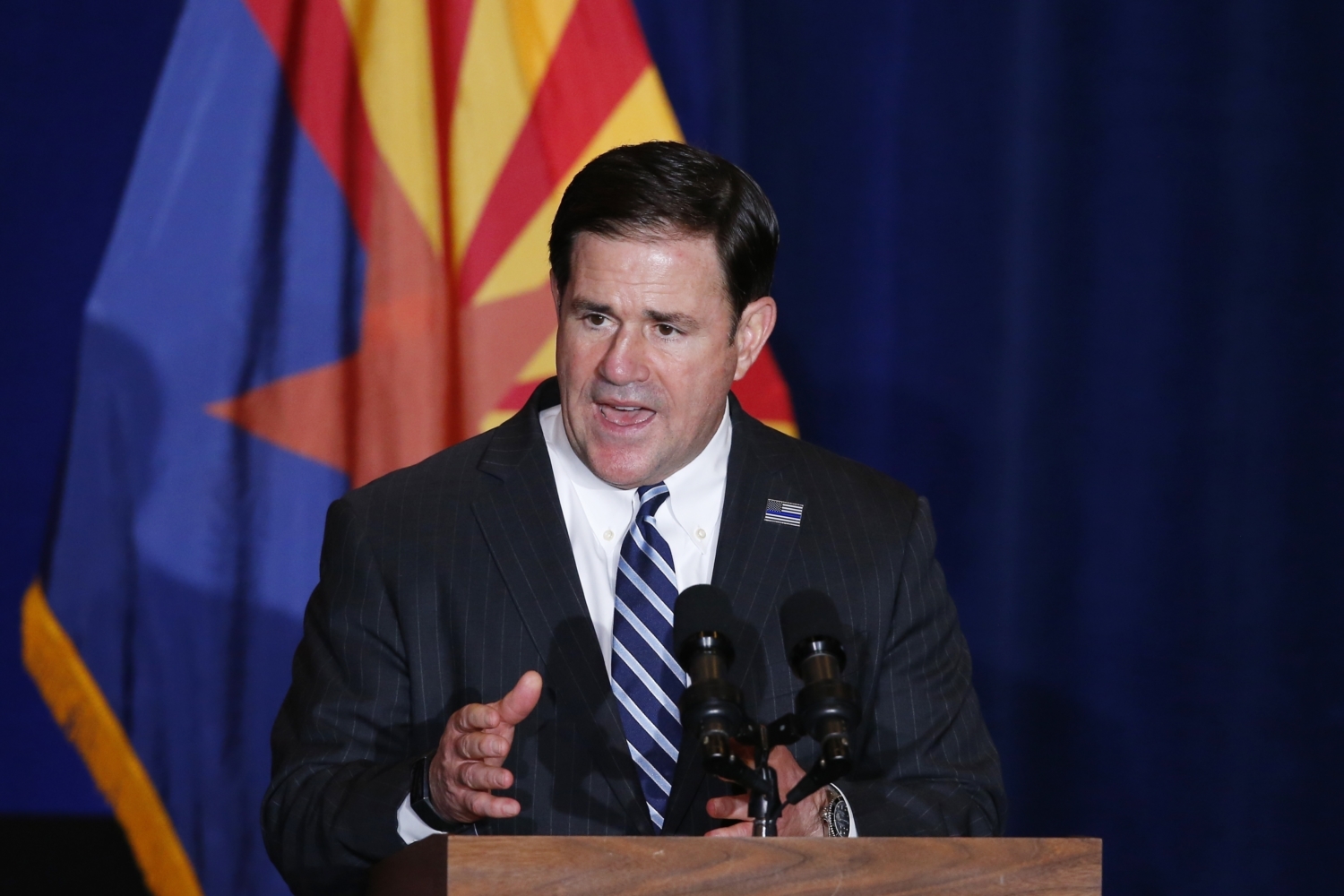 Court Packing States FILE - In this Tuesday, Aug. 11, 2020, file photo, Republican Arizona Gov. Doug Ducey speaks prior to Vice President Mike Pence speaking at the "Latter-Day Saints for Trump" Coalition launch event in Mesa, Ariz. Republicans have criticized a push by some Democrats to expand the number of seats on the U.S. Supreme Court, but their tune has changed when it comes to the highest courts at the state level. In 2016, Ducey signed into law measures expanding the number of seats on the Arizona state Supreme Court. (AP Photo/Ross D. Franklin, File)