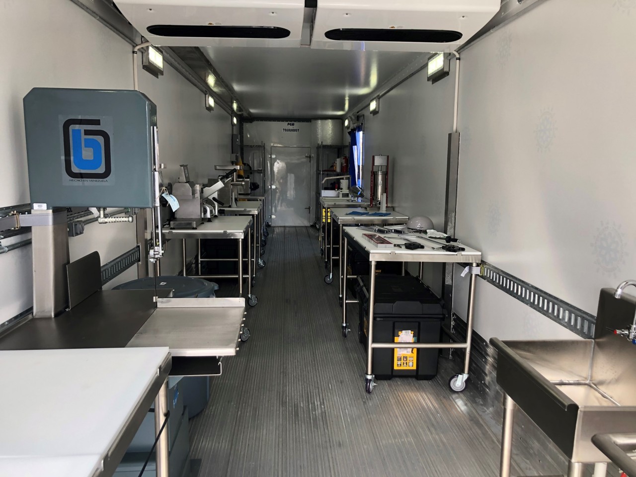 Inside of the meat processing lab trailer showing cutting and prep stations