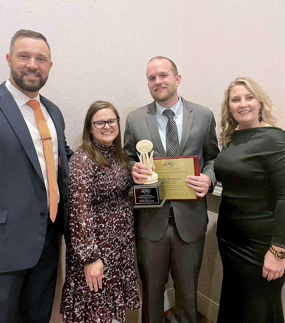 From left, Oklahoma CareerTech State Director Brent Haken, Hannah Branscum, Robby Branscum and OkACTE Executive Director Skye McNiel.