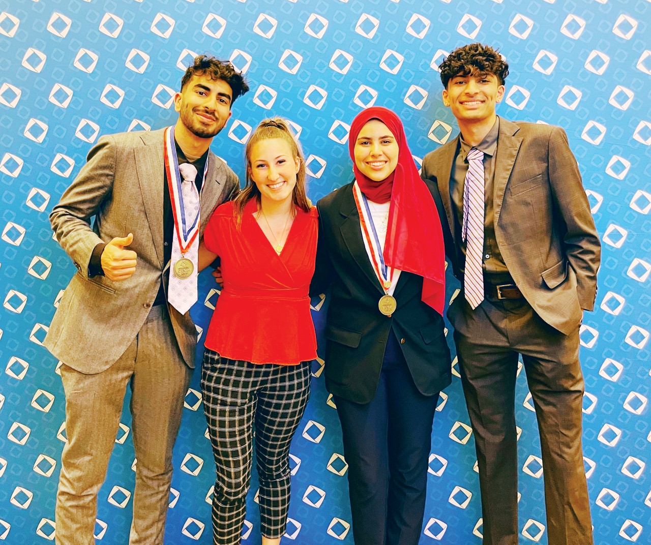 Oklahoma Collegiate DECA members returned from International Career Development Conference in Orlando, Florida, with several finalist honors and a new international officer. Pictured are, from left, Arman Riaz, Ashlyn Coxson, Maryam Amin and Devesh Lahoti.