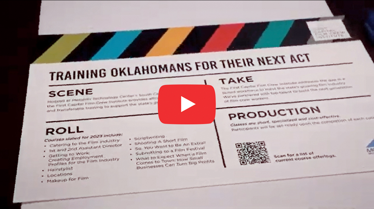 Picture shows text titled "Training Oklahomans for their next act" and explaining aspects of film training in Oklahoma: scene, roll, take and production. Link opens video about film production in Oklahoma in new tab.