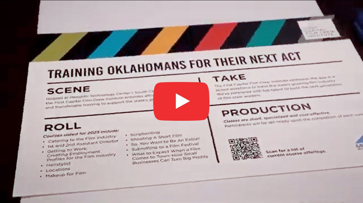 Picture shows text titled "Training Oklahomans for their next act" and explaining aspects of film training in Oklahoma: scene, roll, take and production. Link opens video about film production in Oklahoma in new tab.