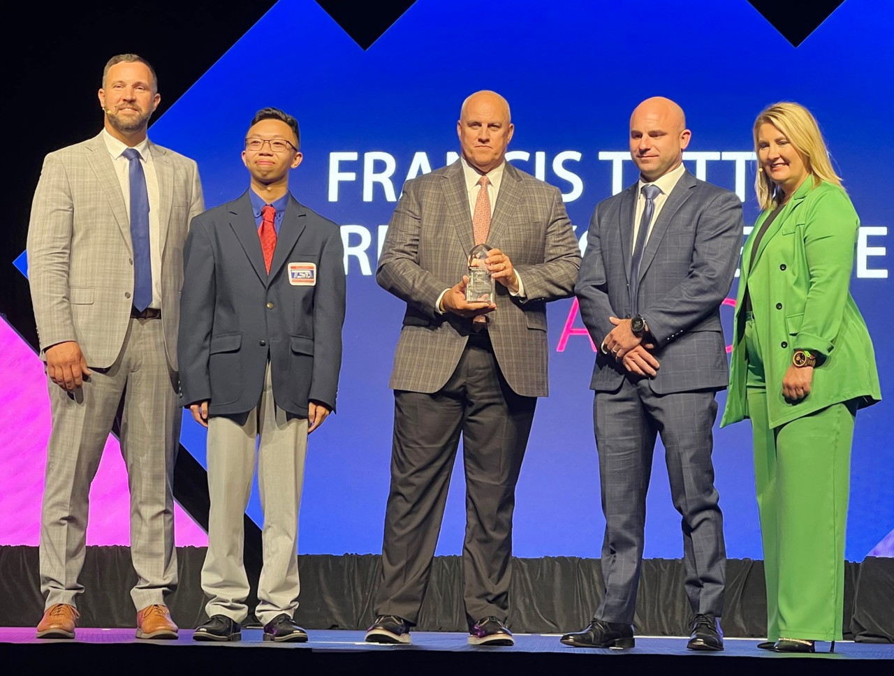 Dwight Hughes, superintendent and CEO of Autry Technology Center, received the Francis Tuttle Award at the 2024 Oklahoma Summit. Picture are, from left, Brent Haken, CareerTech state director; Darick Pham, Oklahoma TSA president; Hughes; Chad Tuttle, Francis Tuttle's grandson; and Skye McNiel, OkACTE executive director.