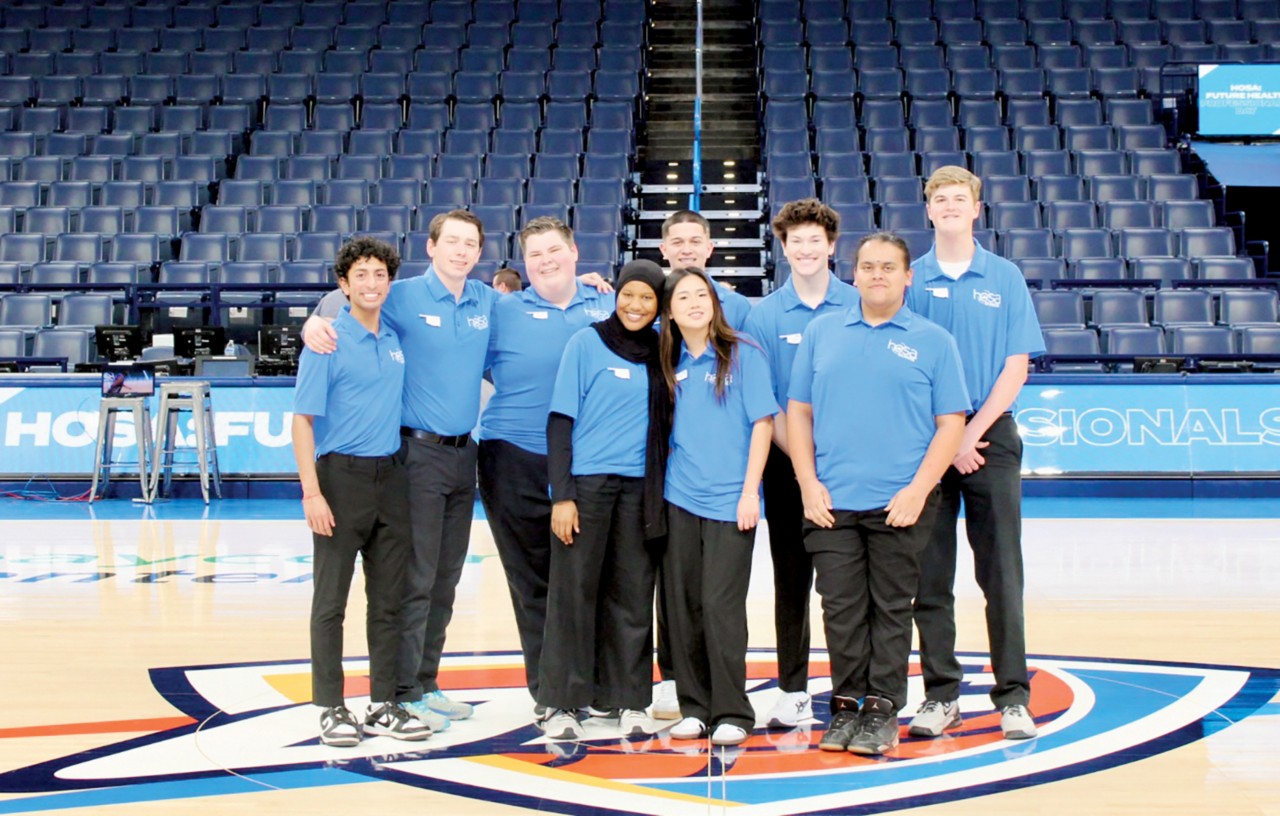 Oklahoma HOSA state officers stand at center court during OKHOSA Day with the Thunder. From left are Reporter Jordan Kuruvilla, Francis Tuttle Tech; President Hunter Brashears, Western Tech; Northeast Region Vice President Kross Brown, Francis Tuttle Tech; Northwest Region Vice President Fathiyah Ayodele, Francis Tuttle Tech; Southeast Region Vice President Adriana Do, Putnam City North High School; Chaplain Logan Rodas, Moore Norman Tech; Treasurer Jack Colby, Francis Tuttle Tech; Central Region Vice President Nathan Sweetman, Moore Norman Tech; and Southwest Region Vice President Corbin Cansler, High Plains Tech.