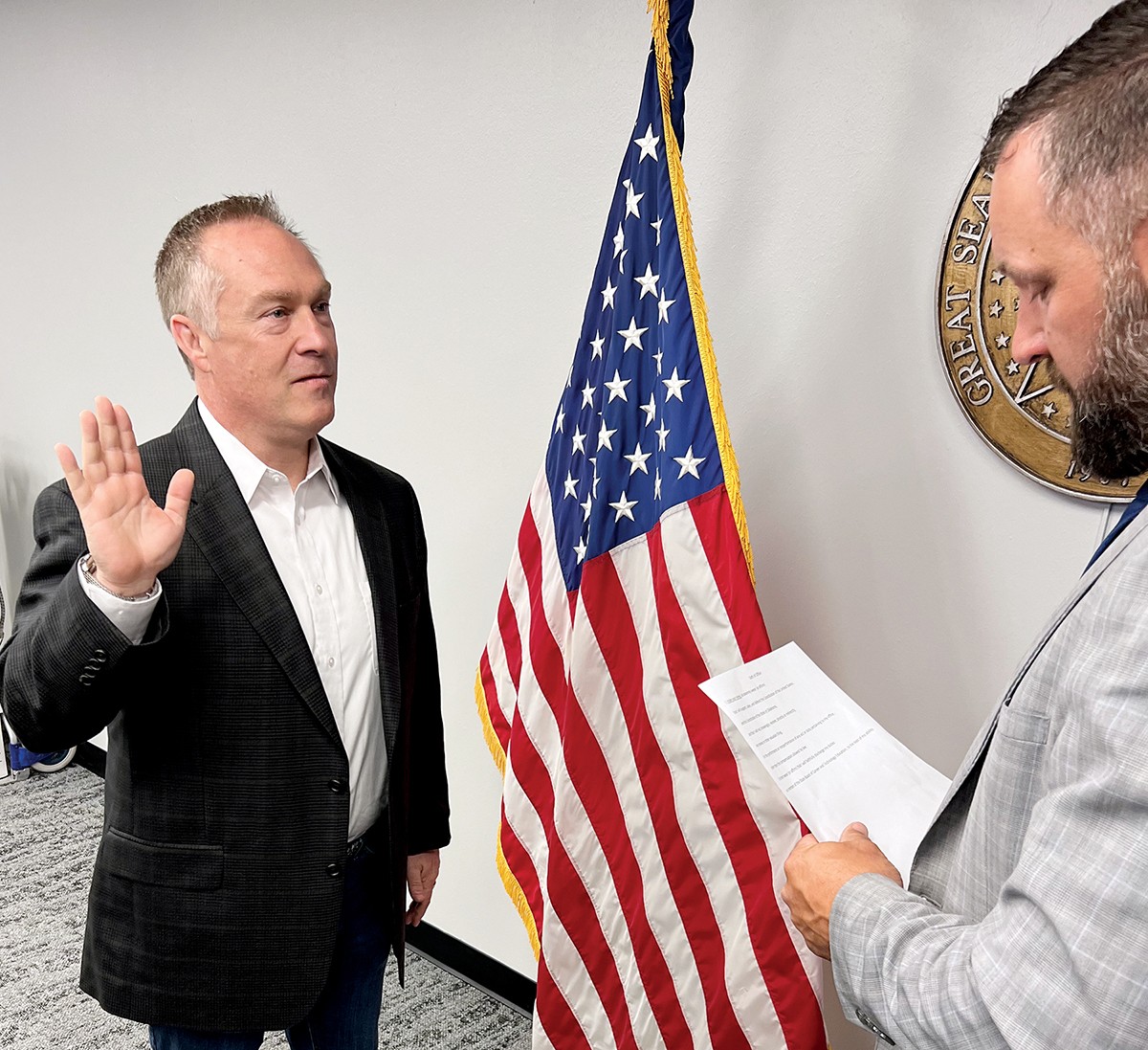 Oklahoma CareerTech State Director Brent Haken, right, swears in Leonard McCullough to the State Board of Career and Technology Education.