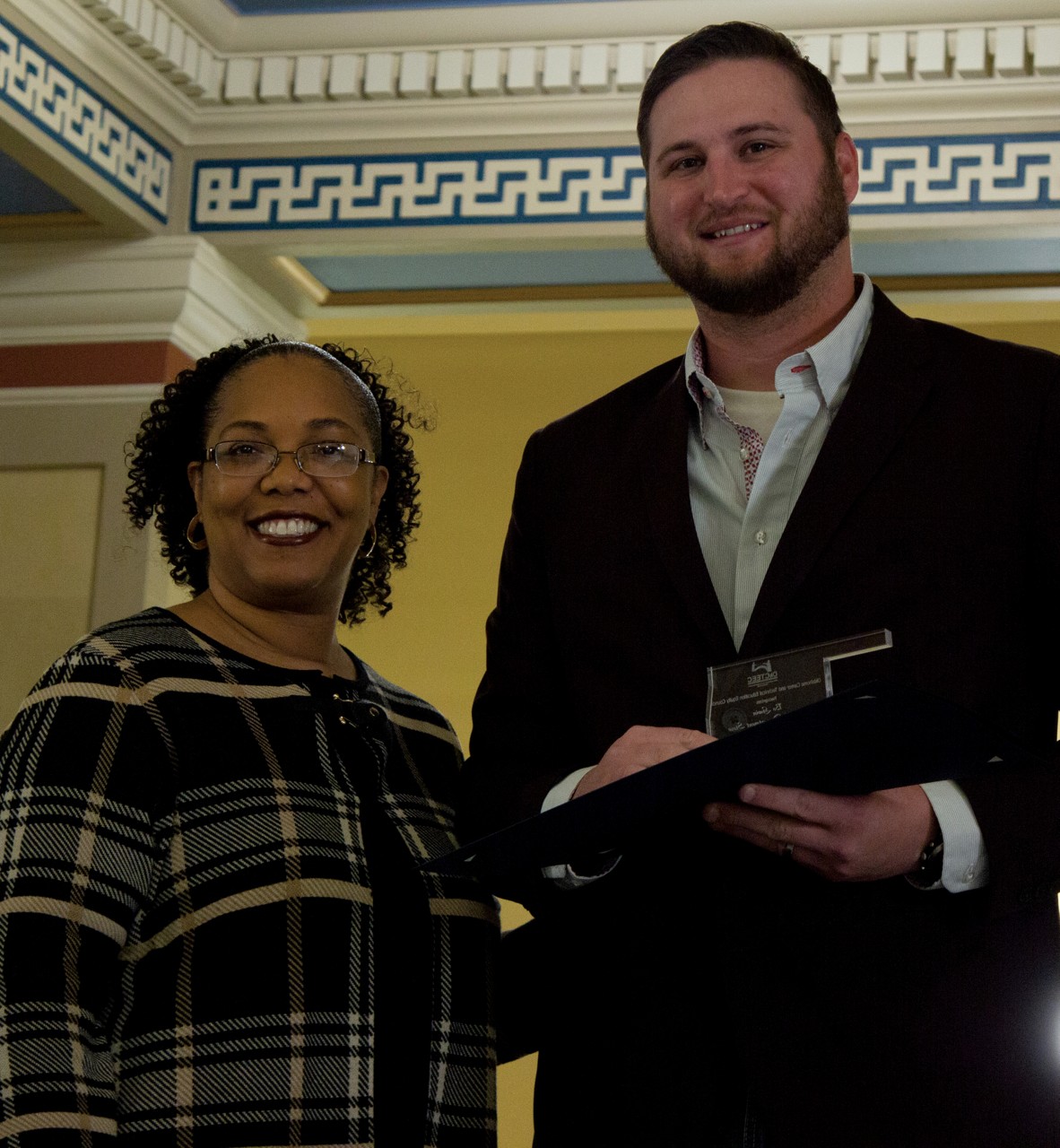 Bo Gwin, right, manager of Sharpe’s Department Store in Okmulgee, recently received the Outstanding Business and Industry Partner award from the Oklahoma Career and Technical Education Equity Council. With him is Goldie Thompson, vice chancellor for student preparation and special programs with the Oklahoma State Regents for Higher Education.
