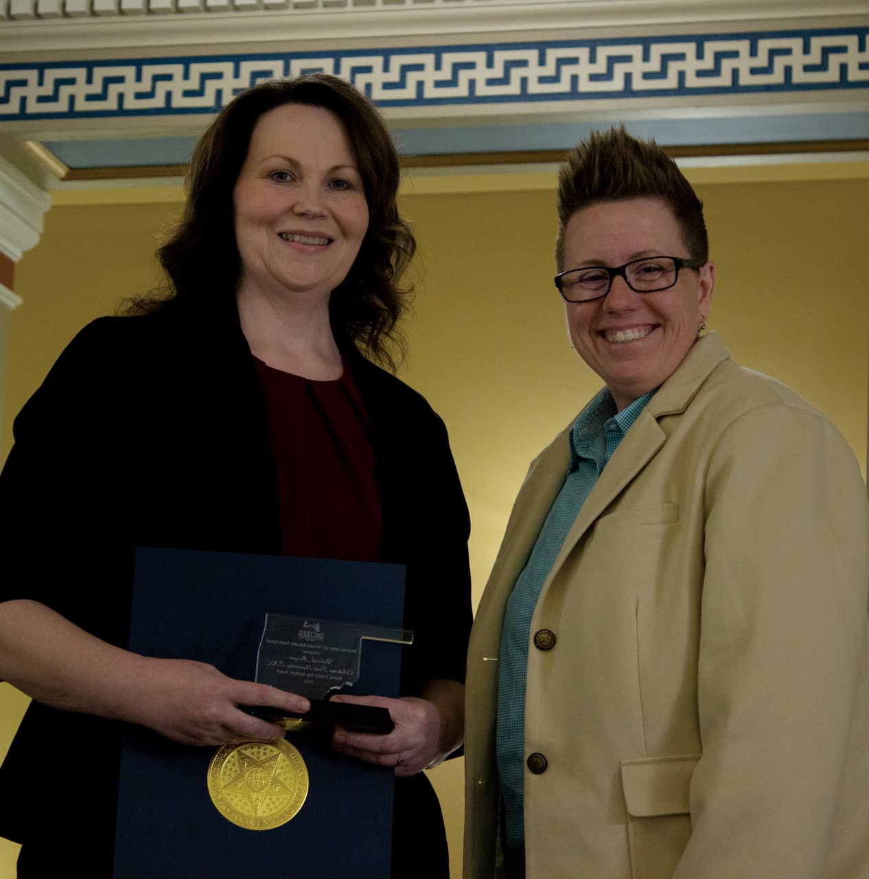 Deborah Morgan, left, Project SOAR director at Oklahoma State University-Oklahoma City, recently received a Making It Work Day Spotlight Award from the Oklahoma Career and Technical Education Equity Council. With her is Sondra Shelby, assistant director of adult and family services for Oklahoma Human Services.
