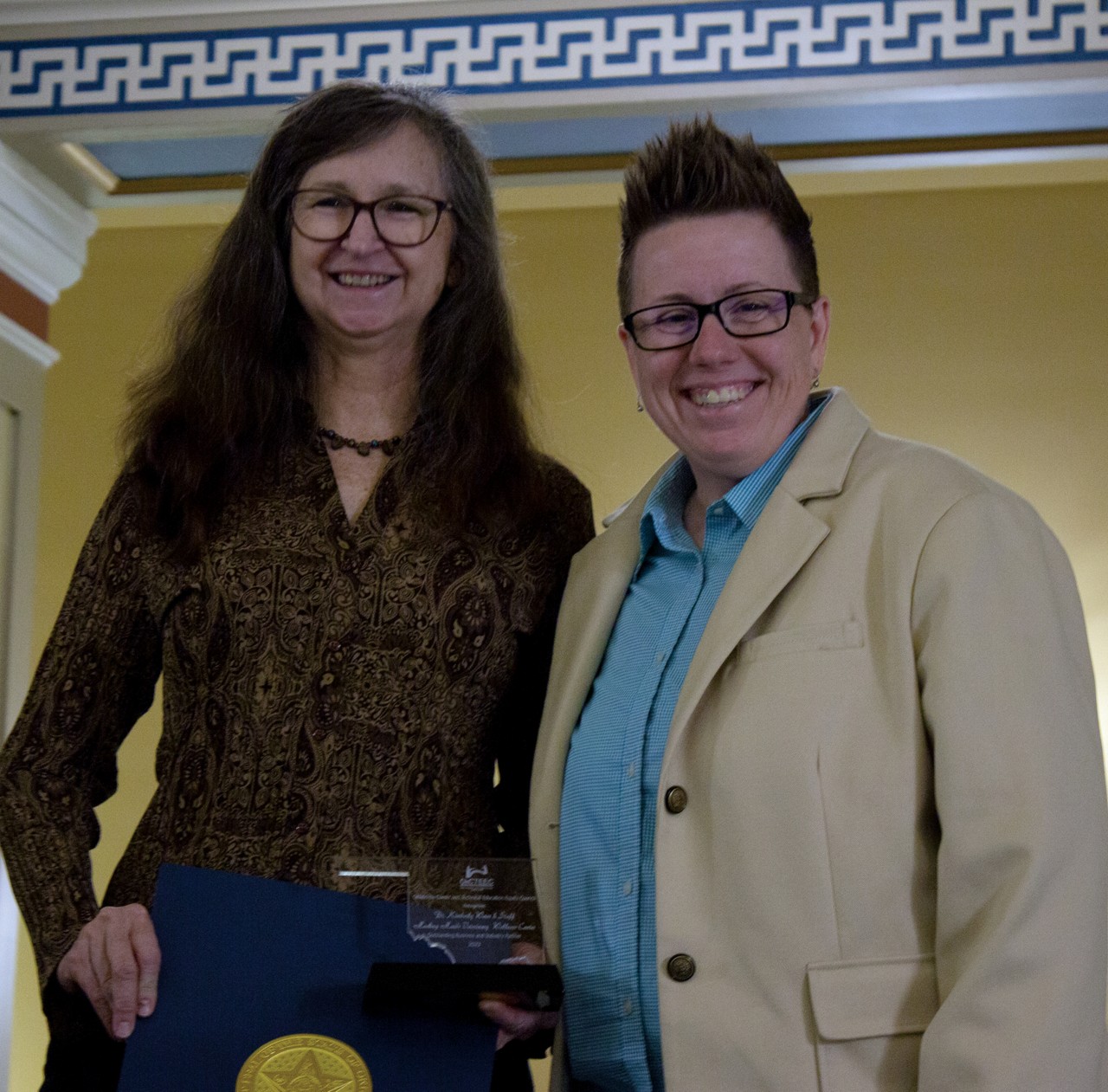 Healing Hands Veterinary Wellness Center of Oklahoma City recently received the Outstanding Business and Industry Partner award from the Oklahoma Career and Technical Education Equity Council. Pictured are Dr. Kimberly Weiss, left, and Sondra Shelby, assistant director of adult and family services for Oklahoma Human Services.