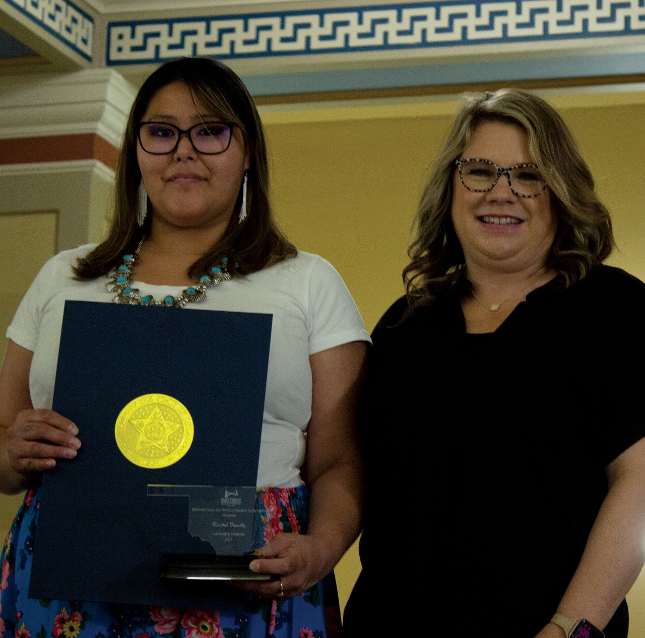 Rosebud Benally, left, a Moore Norman Technology Center graduate, recently received the Outstanding Graduate Award from the Oklahoma Career and Technical Education Equity Council. With her is Kelly Vinson, OkCTEEC president and director of Project Achieve at Northern Oklahoma College.