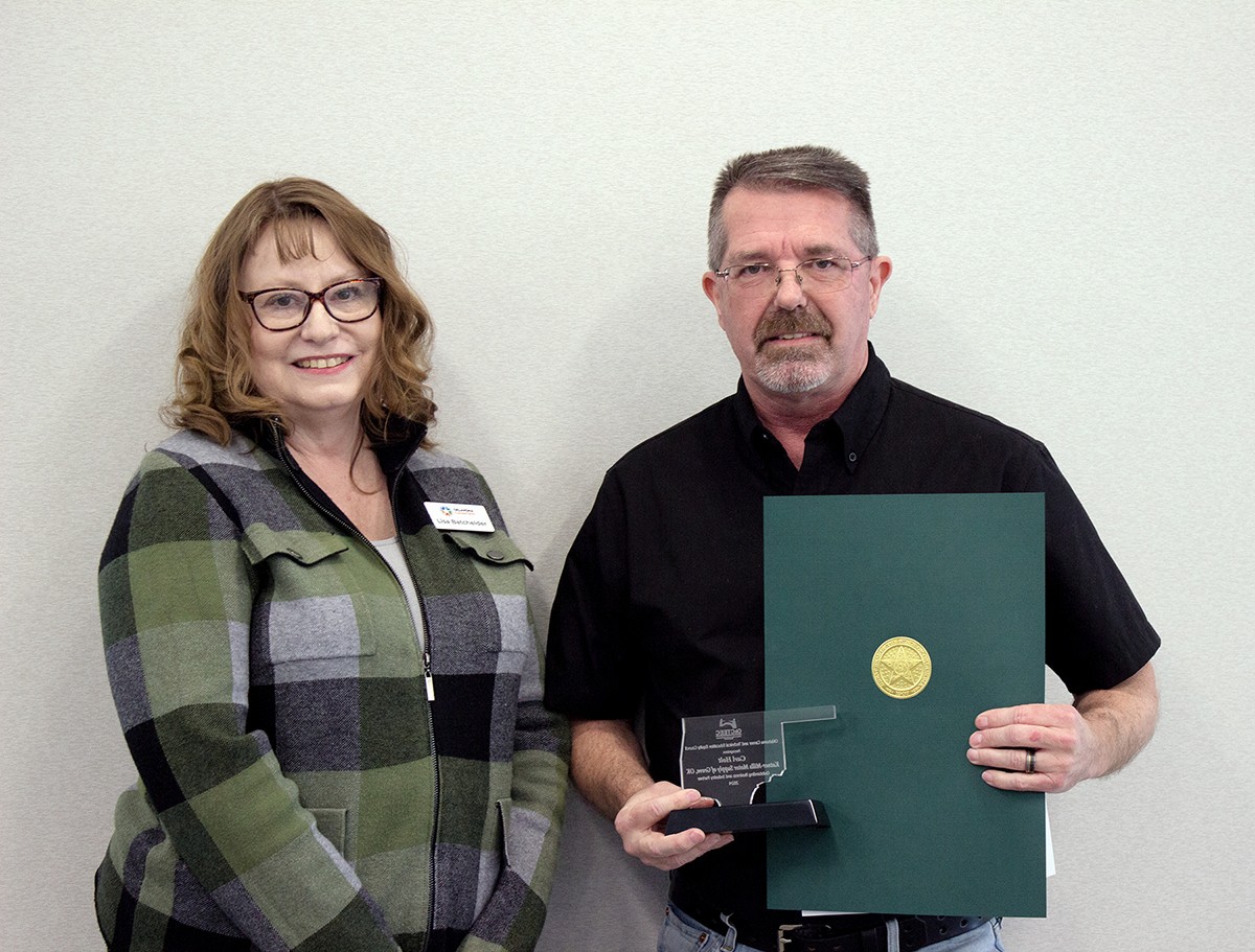 Carl Holt, owner of Katner-Mills Motor Supply of Grove, recently received the Outstanding Business and Industry Partner award from the Oklahoma Career and Technical Education Equity Council. With him is Lisa Batchelder, chief financial officer at the Oklahoma Department of Career and Technology Education.