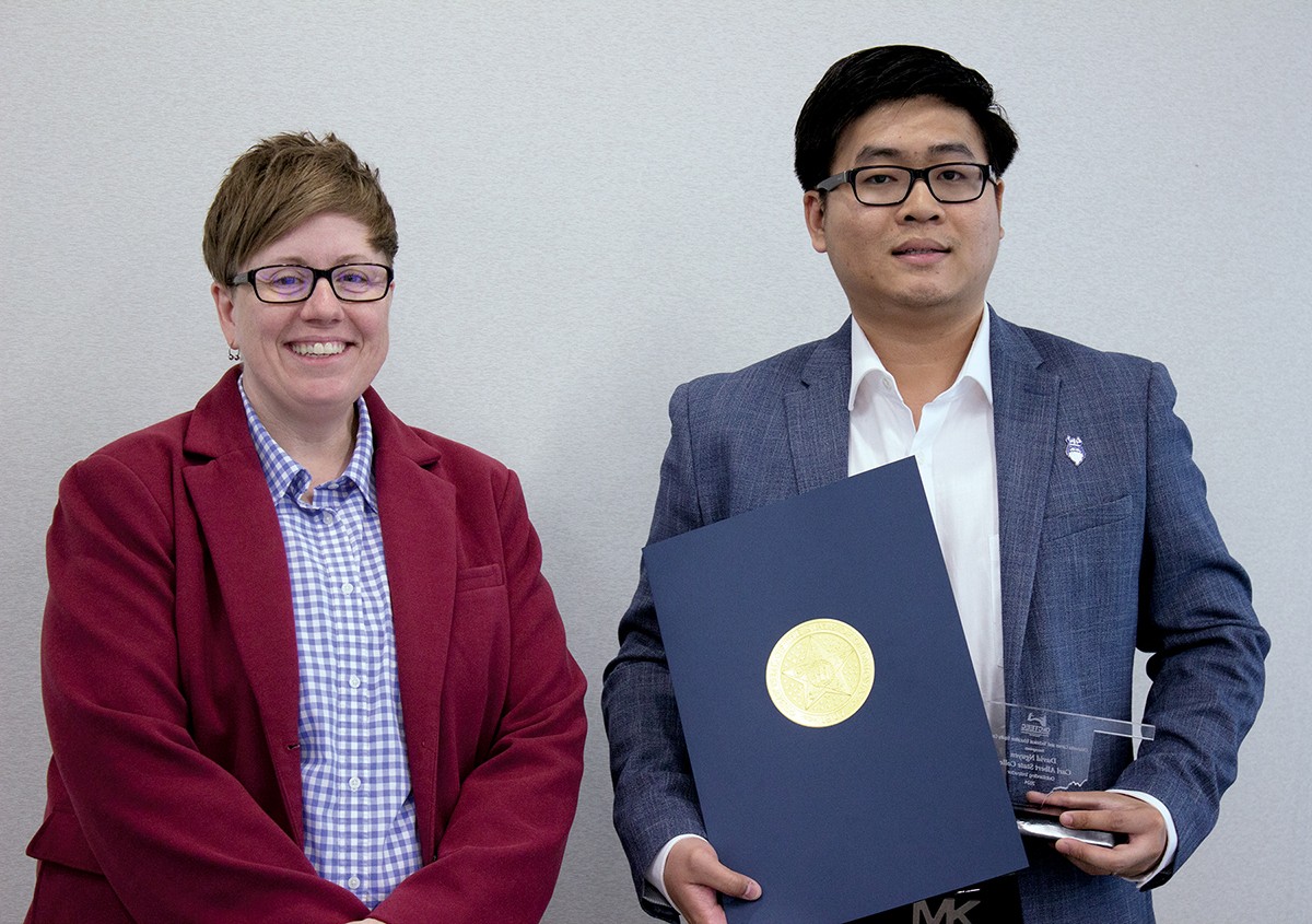 David Nguyen, a Carl Albert State College instructor, recently received the Outstanding Instructor award from the Oklahoma Career and Technical Education Equity Council. With him is Sondra Shelby, assistant director of adult and family services at Oklahoma Human Services.
