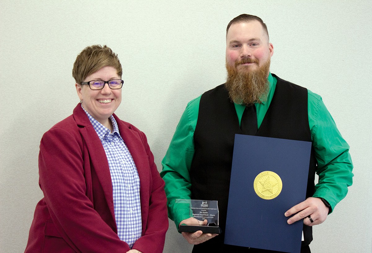 Joe Austin of the Regional Food Bank in Moore recently received the Outstanding Business and Industry Partner award from the Oklahoma Career and Technical Education Equity Council. With him is Sondra Shelby, assistant director of adult and family services at Oklahoma Human Services.