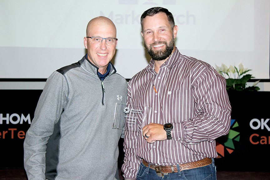 Mark Burch, left, received the Innovation Award. With him is State Director Brent Haken.