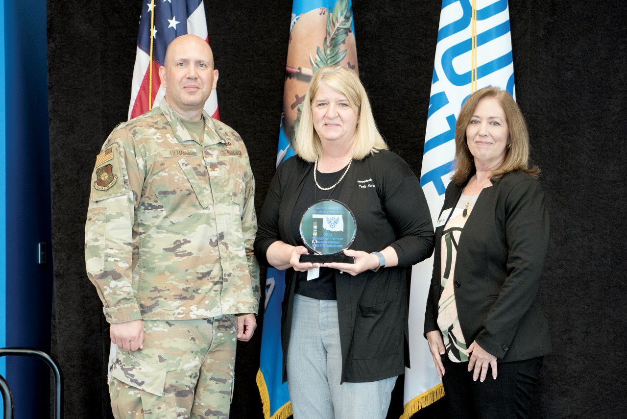 The Air Force Association Central Oklahoma Gerrity Chapter presented Tonja Norwood with the Gerrity Chapter President’s STEM Education Award. Pictured are, from left, Col. Michael Tiemann, vice commander of the 72nd Air Base Wind; Norwood; and Janelle Stafford, AFA Central Oklahoma Gerrity Chapter president.