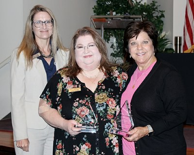 Recipients of the Above and Beyond Pinnacle Award were Tracy Boyington, instructional development specialist in the Resource Center for CareerTech Advancement, center, and Rhonda Foote, health careers education administrative assistant, right. With them is State Director Marcie Mack.