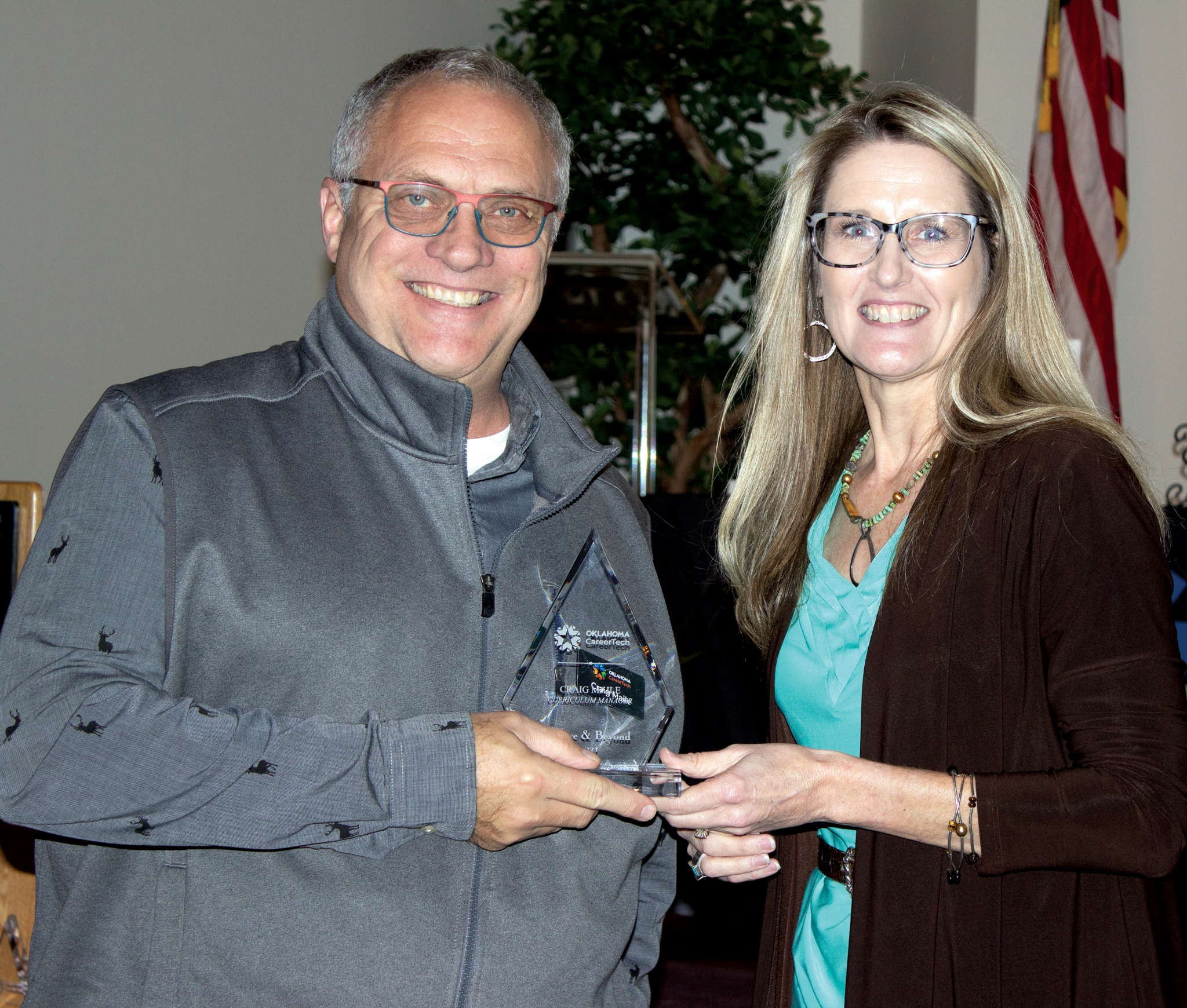 Craig Maile, left, received an Above and Beyond Pinnacle Award. With him is Oklahoma CareerTech State Director Marcie Mack.