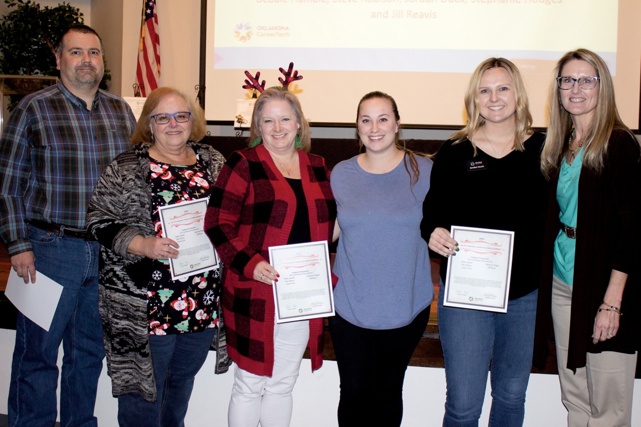 The Federal Programs team won a Team Pinnacle Award. Pictured are, from left, Steve Robison, Debbie Hamble, Stephanie Hodges, Jill Reavis, Jordan Duck and State Director Marcie Mack.
