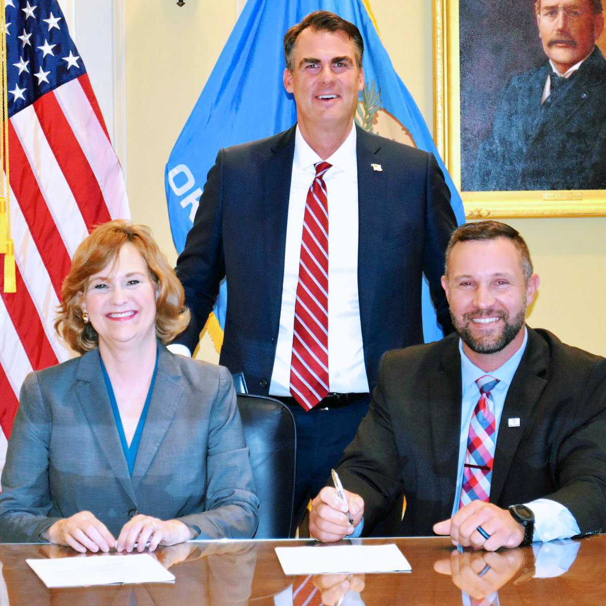 OSRHE Chancellor Allison Garrett and CareerTech State Director Brent Haken signed a statewide nursing articulation agreement for Oklahoma public four-year universities to award credit for prior learning for students completing a practical nursing program at 28 technology centers. Pictured are, from left, Garrett, Gov. Kevin Stitt and Haken.