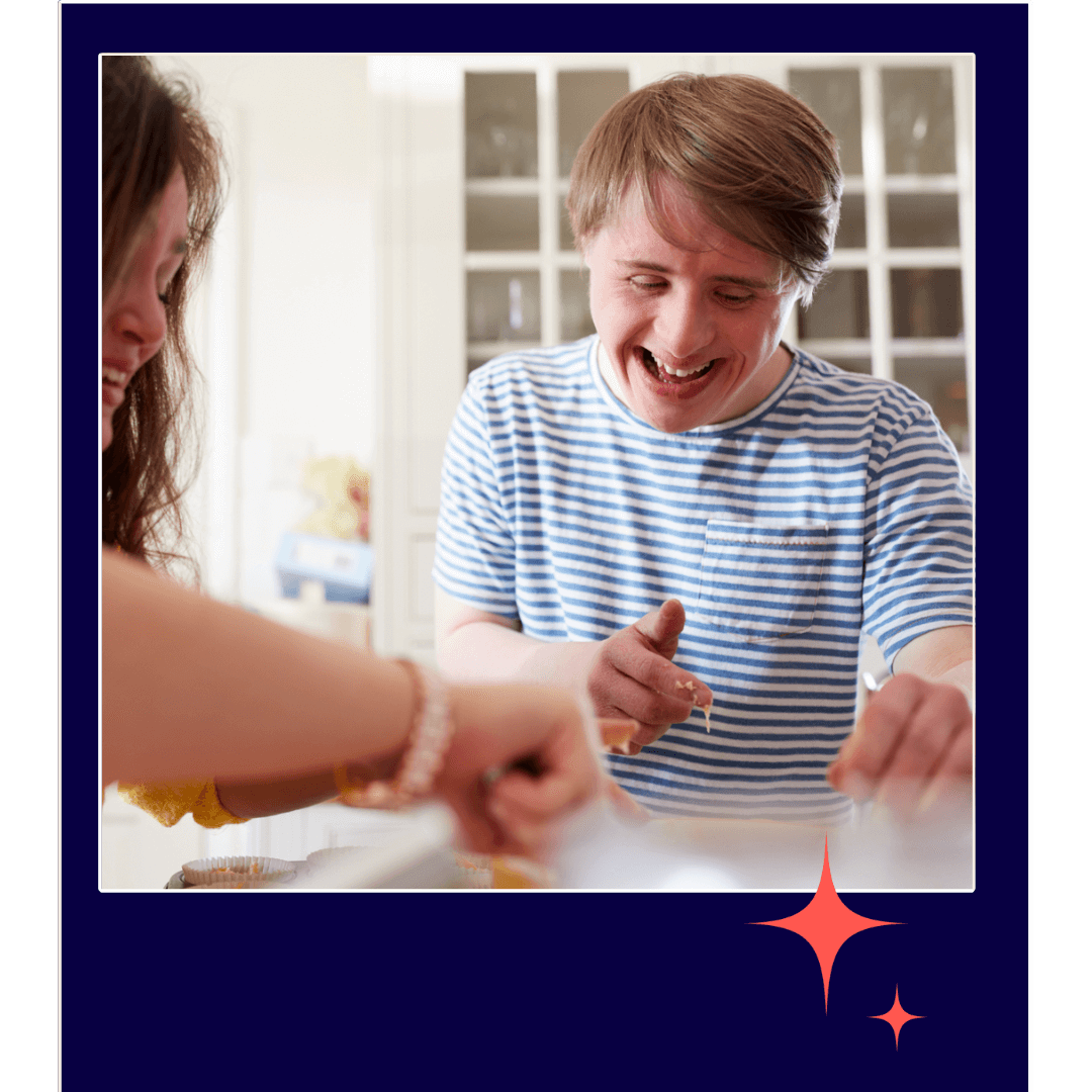 Man in striped shirt and woman with dark hair baking in a kitchen.