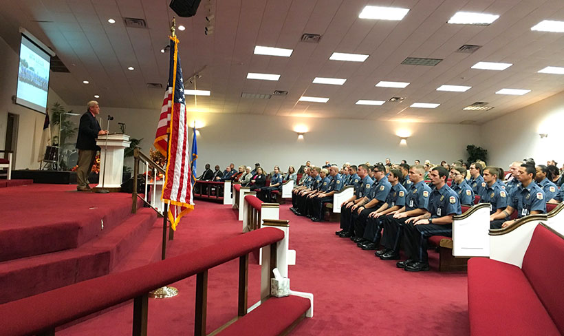 Room view of cadets, family and friends prior to graduation ceremony
