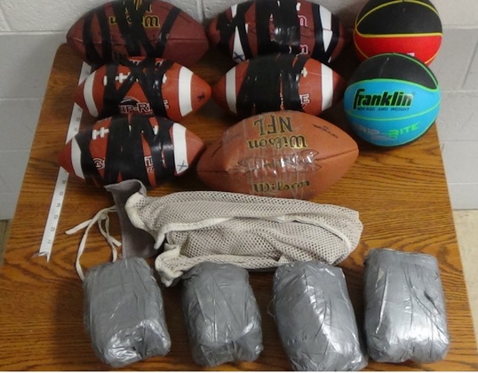 Contraband items sealed inside footballs and basketballs were thrown over the fence at Dick Conner Correctional Center.