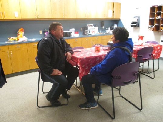 Dick Conner Correctional Center Chief of Security Shawn Price surprising Hominy Middle School student Jimmy Hamilton.