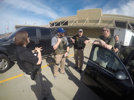 Oklahoma DOC fugitive apprehension agents regroup after a recent interview with a known associate of Edmund Owens, who is a Top 15 Fugitive.