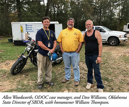 Allen Woodworth, ODOC case manager, and Don Williams, Oklahoma State Director of SBDR, with homeowner William Thompson. 