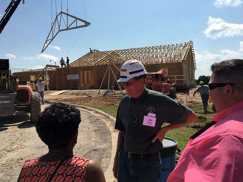 Joe Wilson with World Mission Builders talks with Oklahoman reporter
