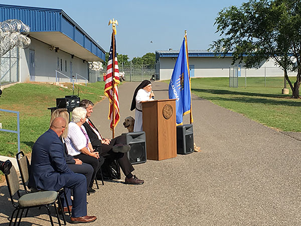 Sister Pauline Quinn speaks at grand opening of the Serelda Cody Dog Training Facility