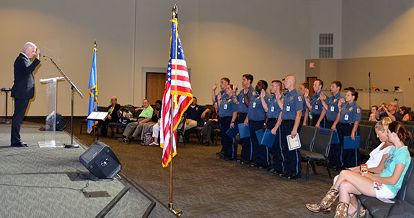 ODOC's David Edelman, Security and Facility Operations Manager, swears in Wednesday's graduating class of cadets