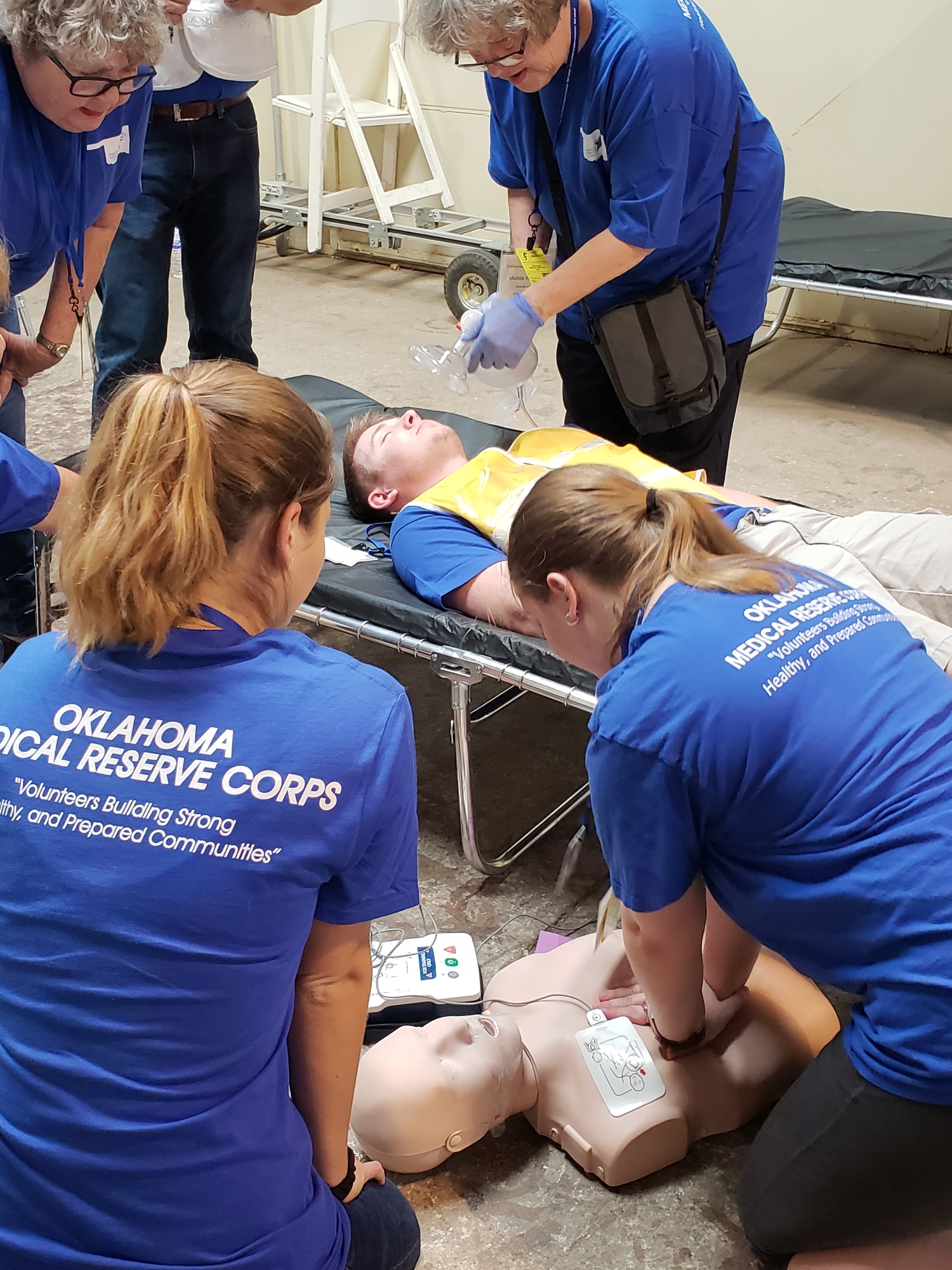 volunteers practice first aid and CPR