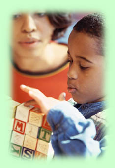 boy using toy blocks