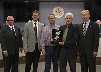 	The Governor???s Safety Excellence Award is presented annually to the ODOT field division with the best overall safety record in the past year. The 2017 award went to Division Five, which increased its safety performance record by 72 percent compared with the previous year. Pictured from left are Commission Chairman David Burrage, District Five Commissioner Todd Huckabay, Division Five Safety Manager Jim Reeves, Division Five Engineer Brent Almquist and ODOT Executive Director Mike Patterson. Counties in Division 5 include Beckham, Blaine, Custer, Dewey, Greer, Harmon, Jackson, Kiowa, Roger Mills, Tillman and Washita.