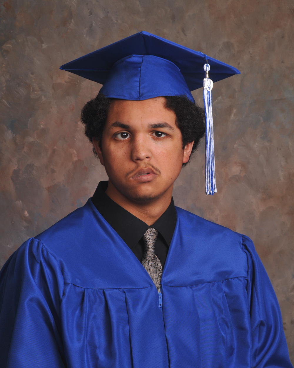 Portrait of Nick Jackson in cap and gown