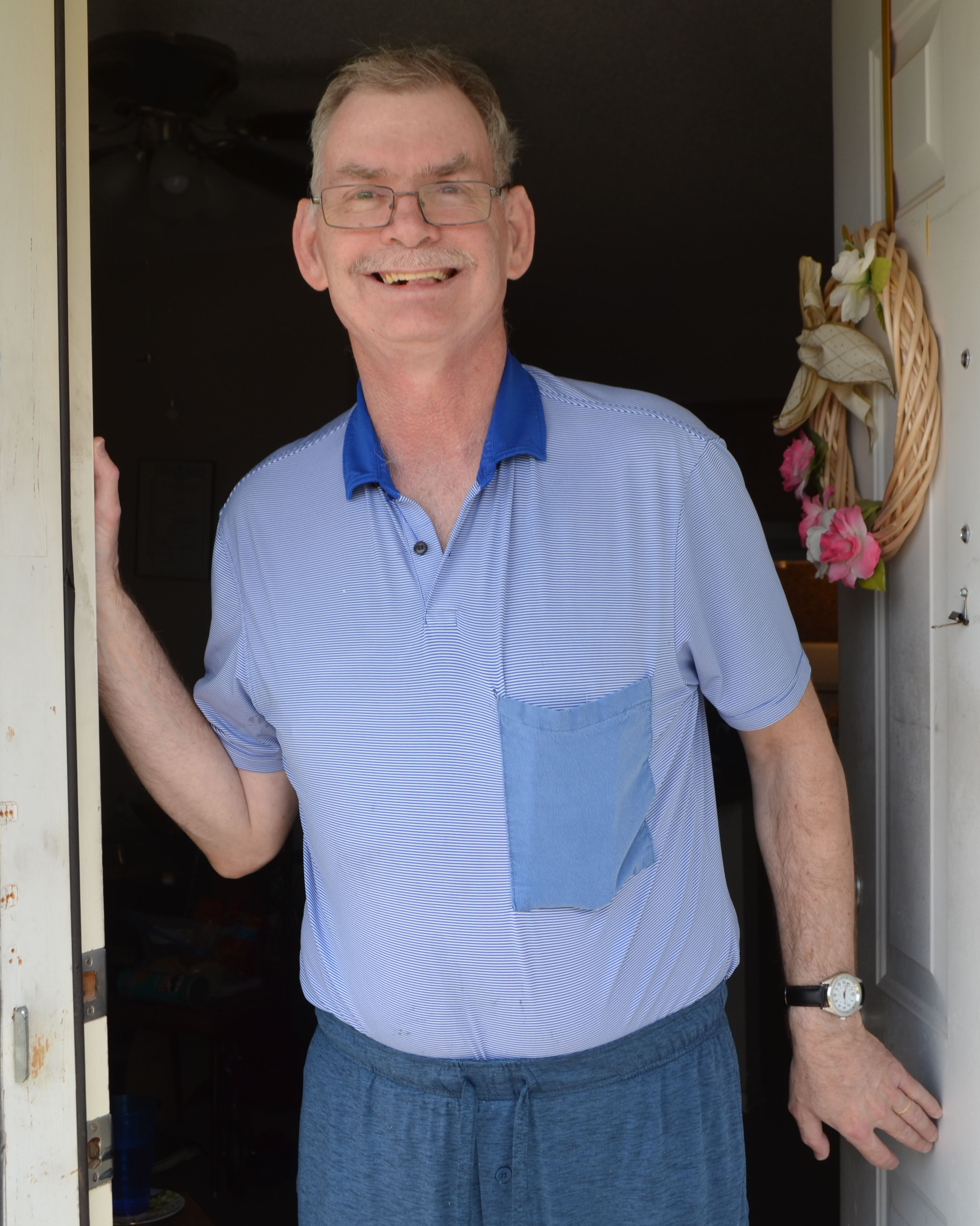 Smiling man in a doorway