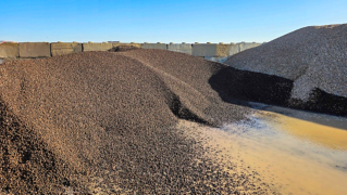 Mounds of the light aggregate used for the SH-94 bridge research project.