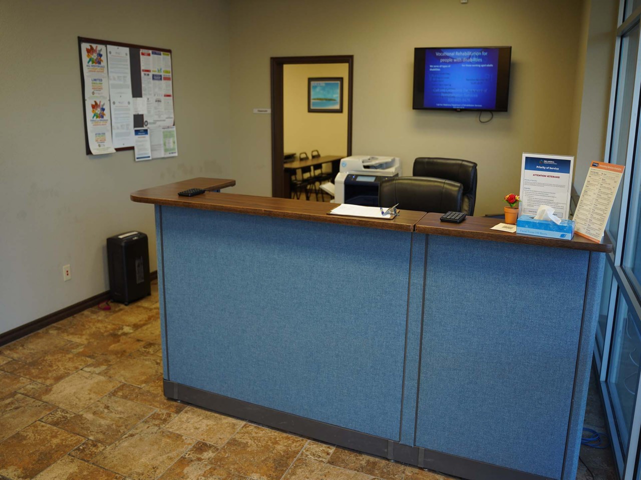                         Office interior and front desk reception area.    