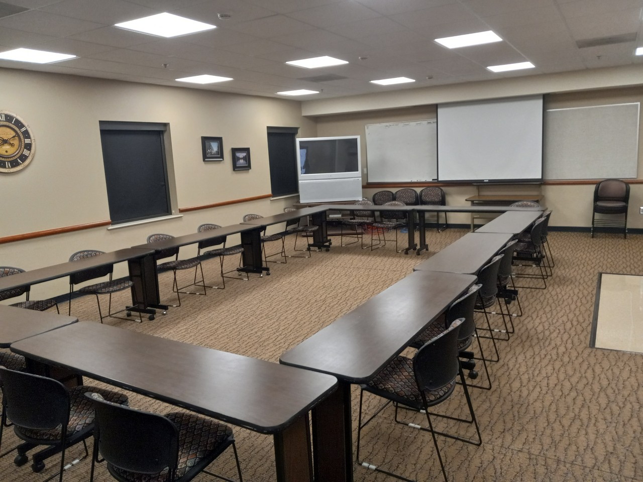 Conference or training room with available TV,  white board, projector and tables/chairs.          