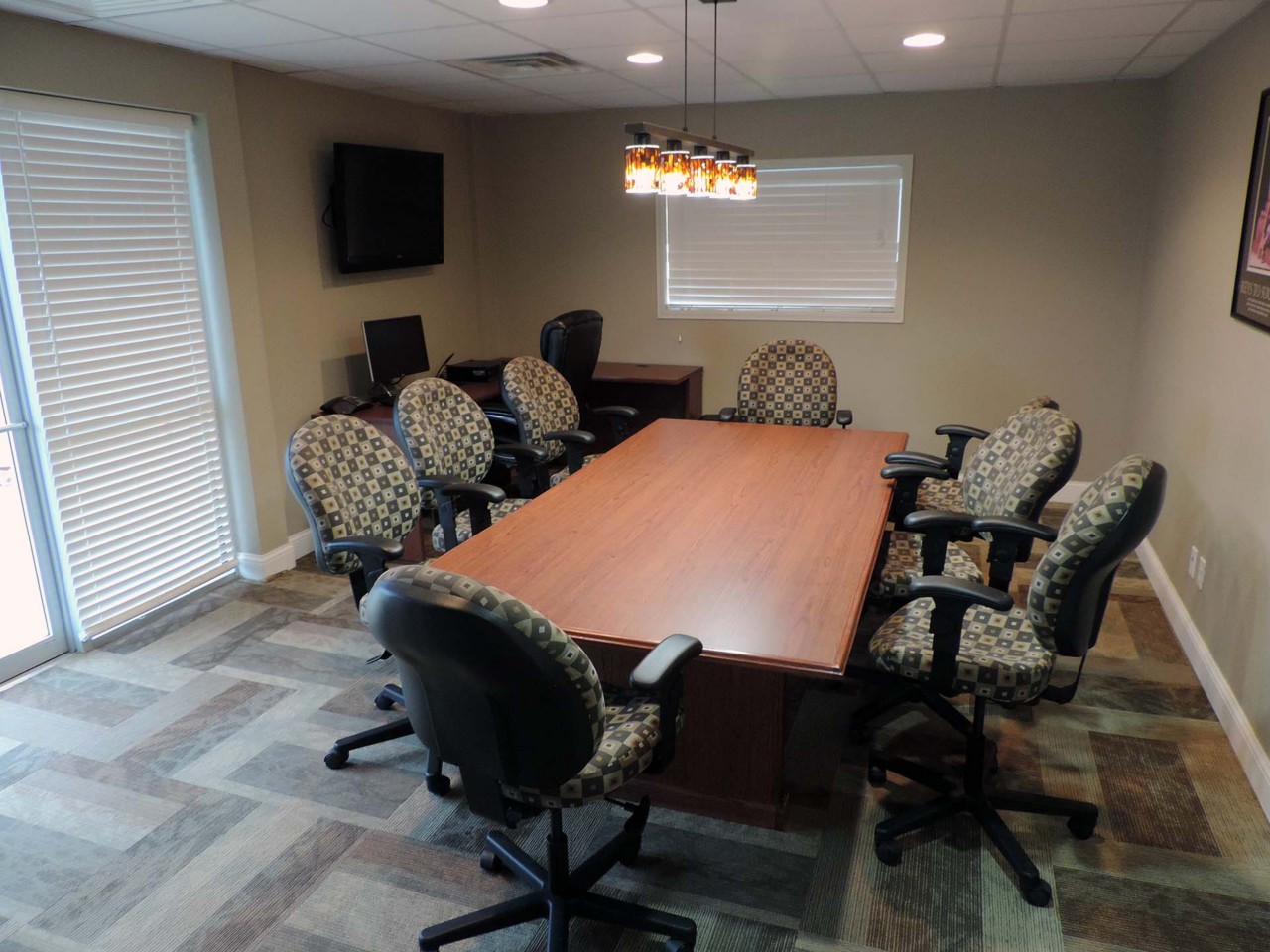 Conference or training room with available TV, computer and tables/chairs.          