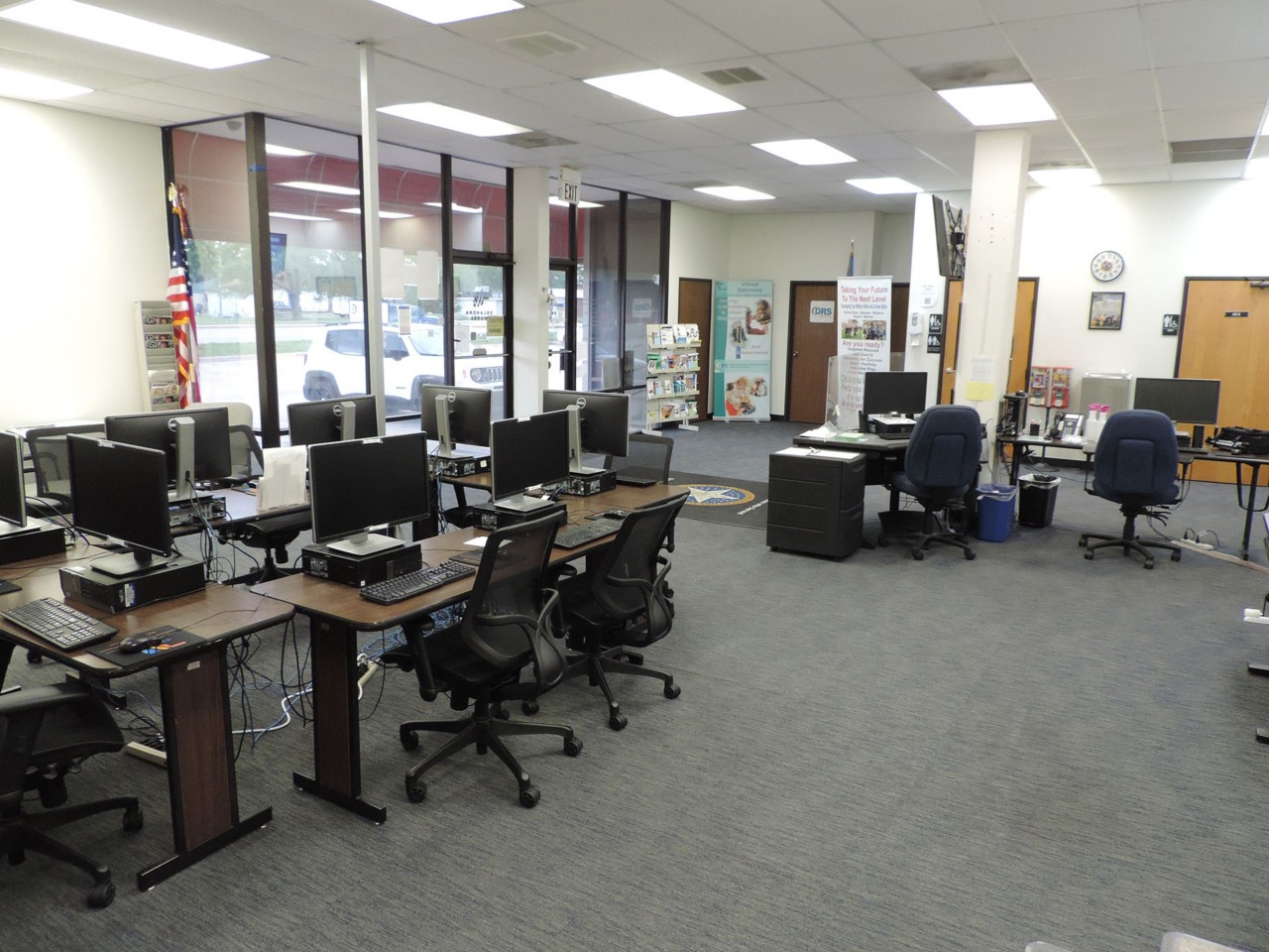 Resource area with computers and a printer/scanner/fax available to the public.