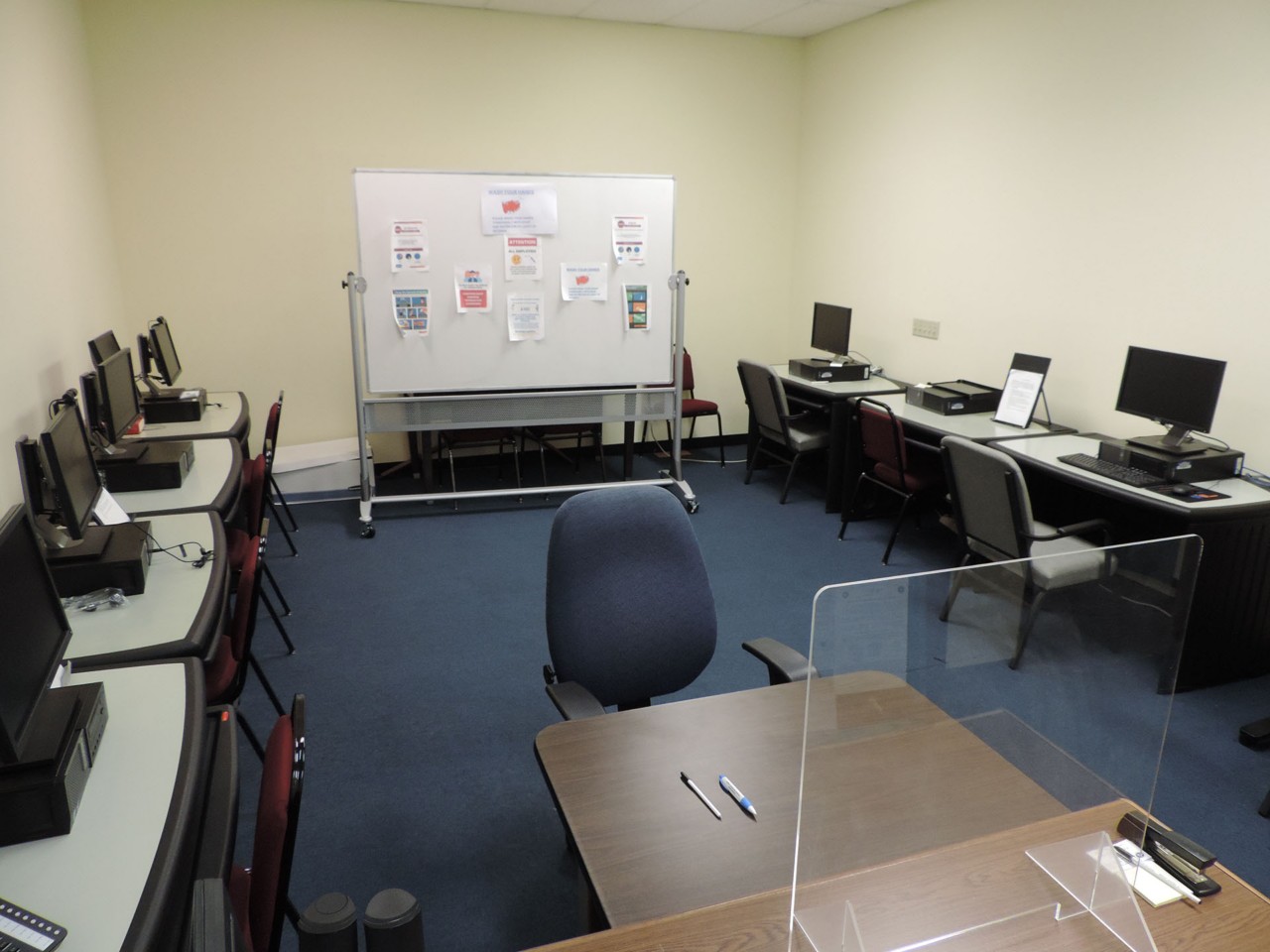 Training or testing room with available computers and white board.
