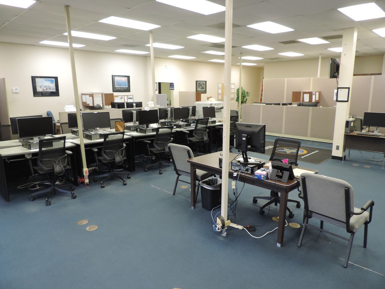 Resource area with computers and a printer/scanner/fax available to the public.