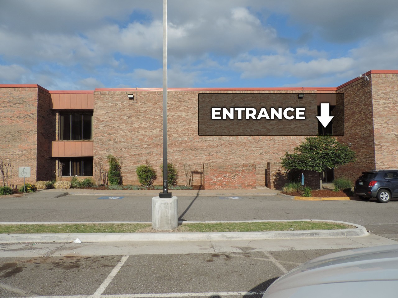 Exterior entrance to office from the parking area behind building.