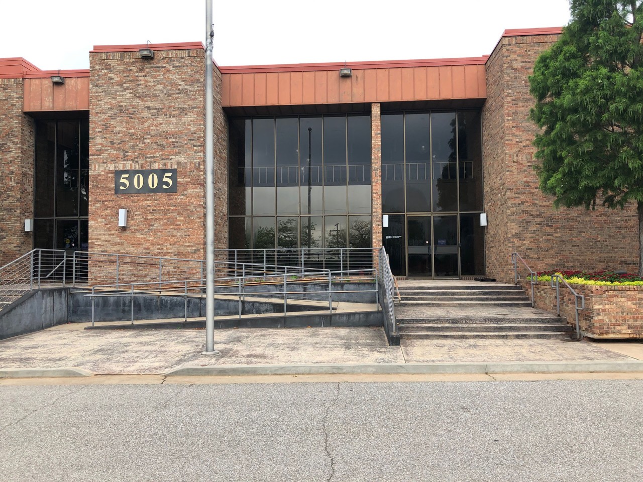 Office front exterior view from the street or parking area.