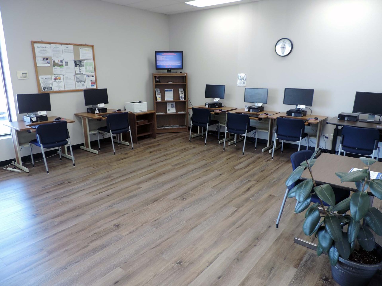 Resource area with computers and a printer/scanner/fax available to the public.          